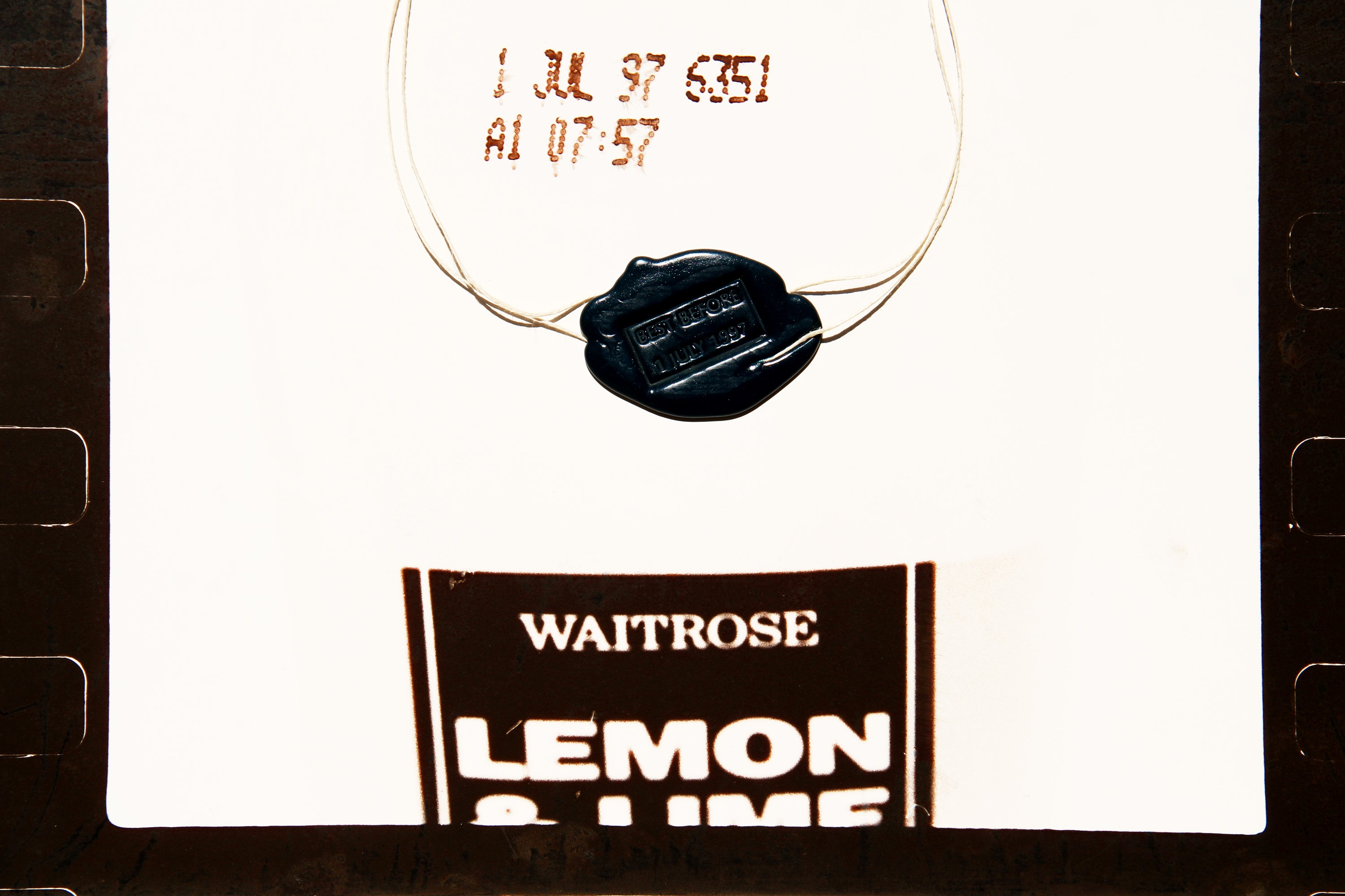 Huang Yong Ping - Best Before 1 July 1997 (Waitrose Lemon) — collage con spago e ceralacca su fot...